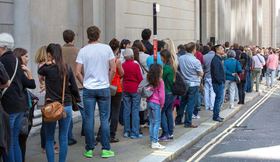 An image of a queue in London representing AWS SQS.