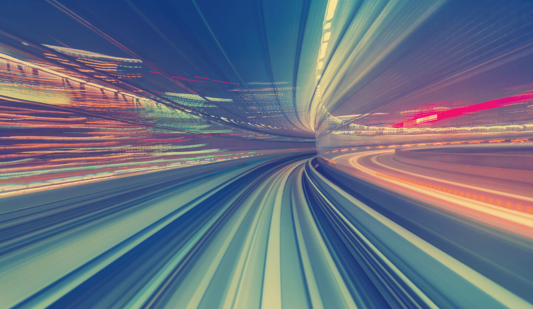 The main image for speeding up serverless development, showing an abstract image of travelling at speed.